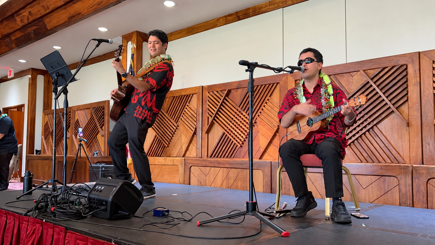 Darrin Chinen performing on stage with another musician